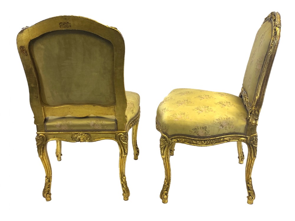 A pair of late 19th-century Rococo Revival giltwood side chairs upholstered in patterned green silk fabric with carved cabriole legs. View II