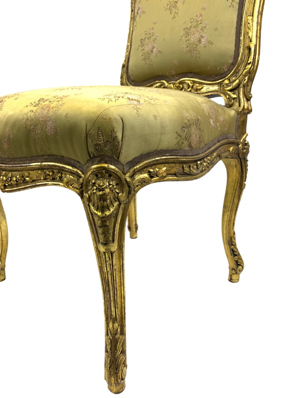 A pair of late 19th-century Rococo Revival giltwood side chairs upholstered in patterned green silk fabric with carved cabriole legs. View IV