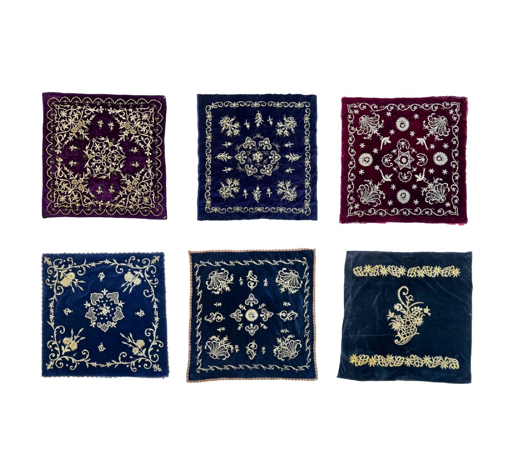 Six individual square 19th-century Ottoman velvet panels in deep blue, purple, and crimson, decorated with intricate gold and silver metallic thread embroidery.