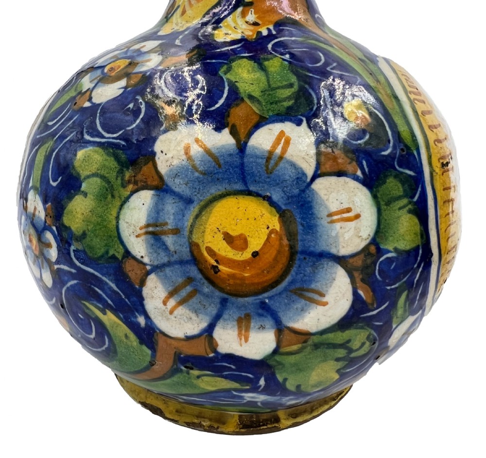 A pair of round 18th-century Italian maiolica ceramic vases painted in blue, yellow, and green with profile portrait medallions on bulbous bodies. View VIII