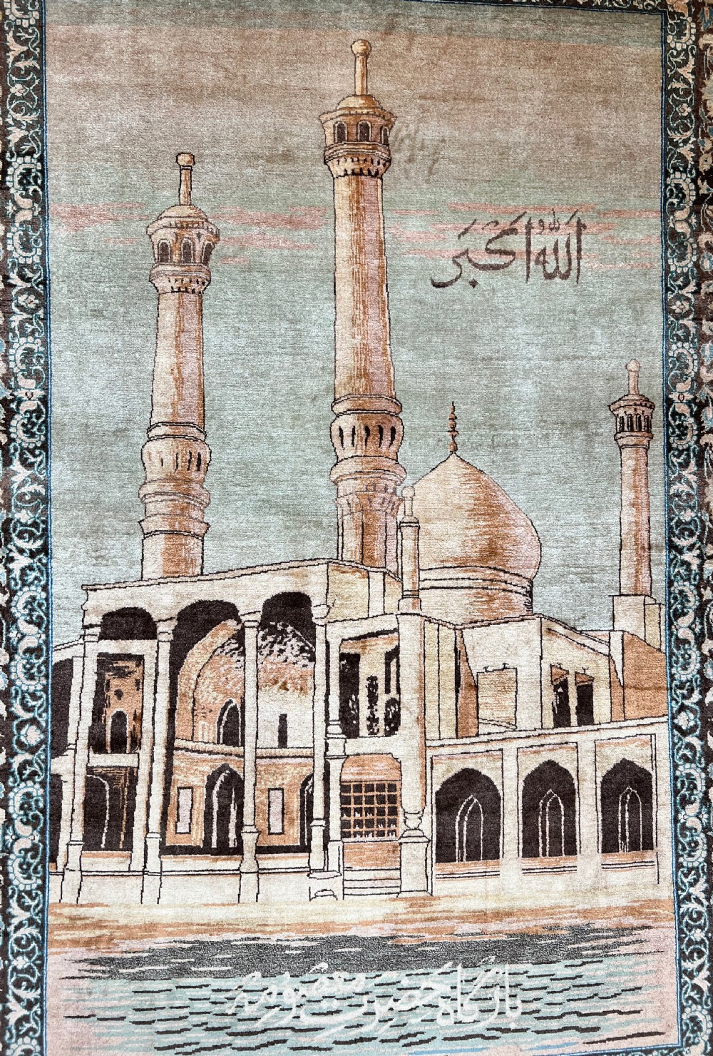 A pair of matching hand-knotted wool Kashan rugs featuring architectural scenes with minarets, domes, Arabic calligraphy, and ornate floral borders. View II