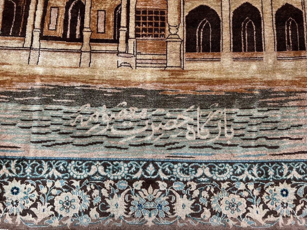 A pair of matching hand-knotted wool Kashan rugs featuring architectural scenes with minarets, domes, Arabic calligraphy, and ornate floral borders. View III