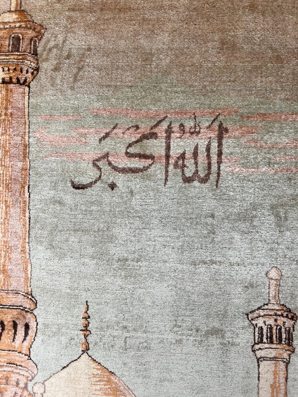 A pair of matching hand-knotted wool Kashan rugs featuring architectural scenes with minarets, domes, Arabic calligraphy, and ornate floral borders. View VI
