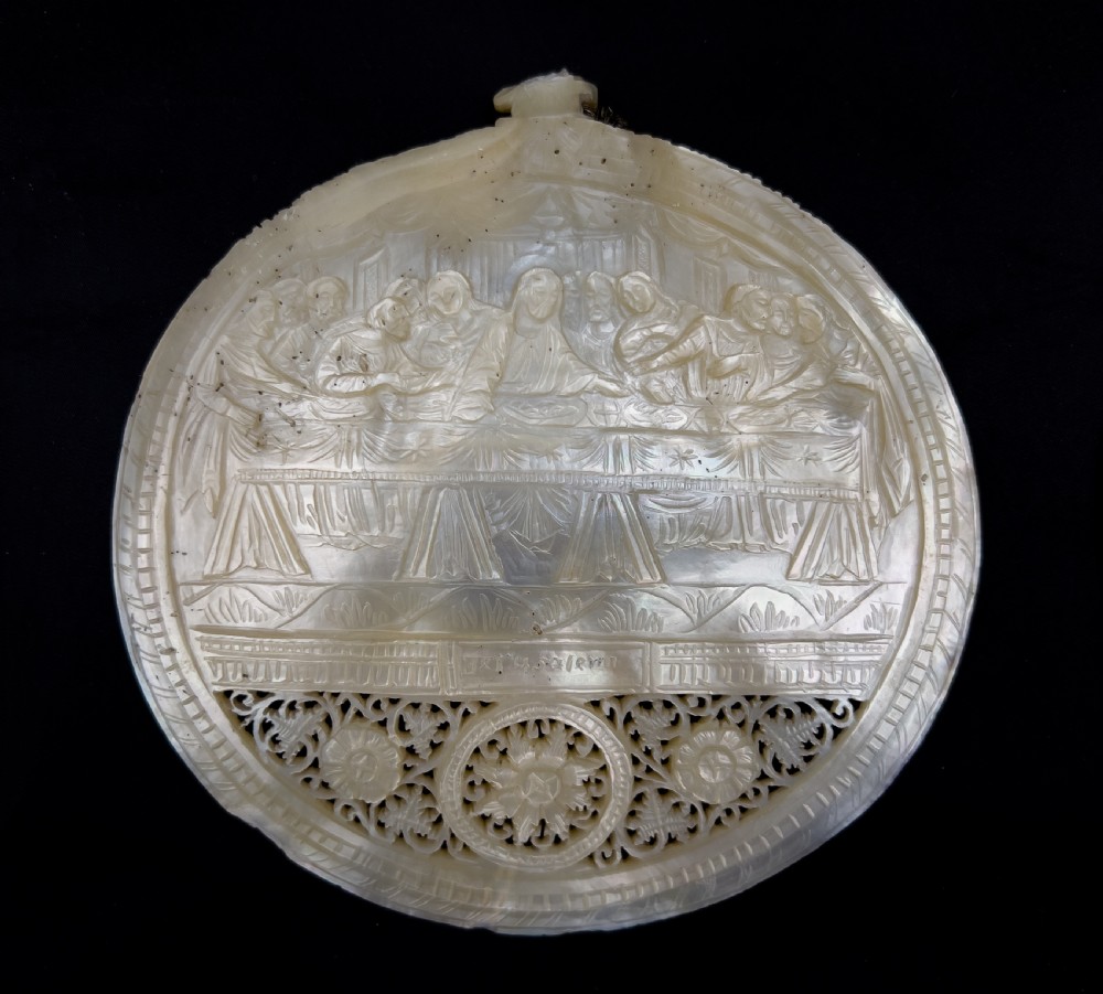 A set of five intricately hand-carved mother of pearl shells depicting biblical scenes with detailed pierced fretwork borders. View III