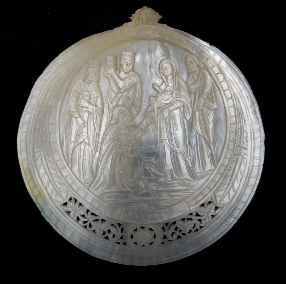 A set of five intricately hand-carved mother of pearl shells depicting biblical scenes with detailed pierced fretwork borders. View V