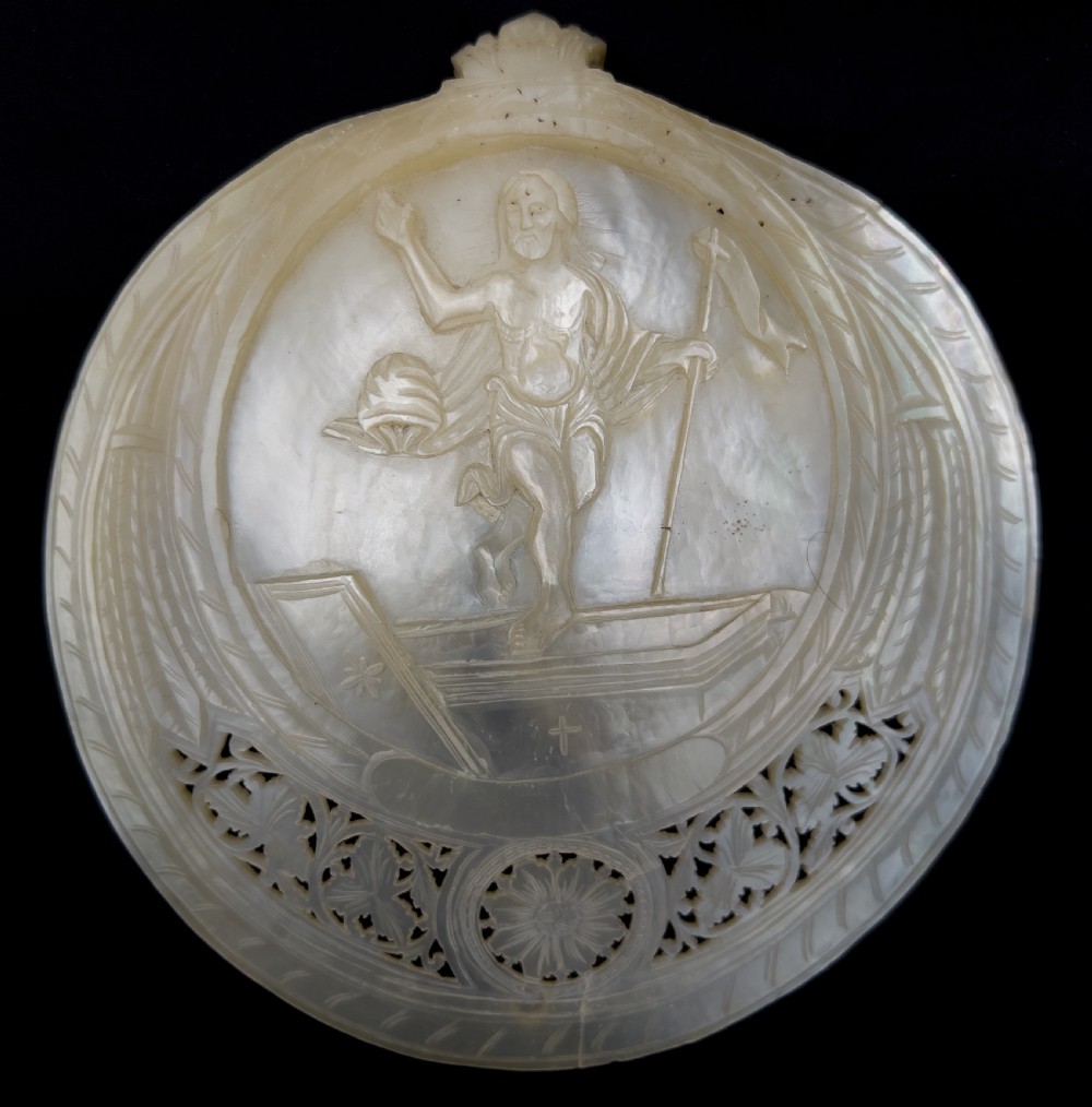 A set of five intricately hand-carved mother of pearl shells depicting biblical scenes with detailed pierced fretwork borders. View VI