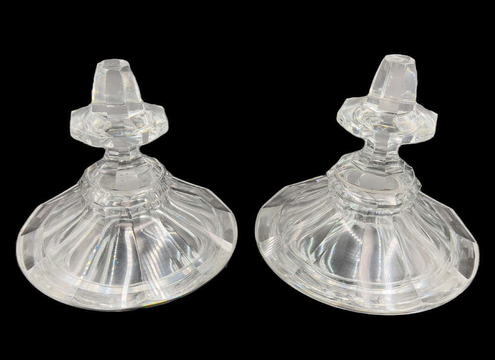 A pair of clear cut glass lidded urns featuring etched woodland motifs and faceted pedestal bases. View XI