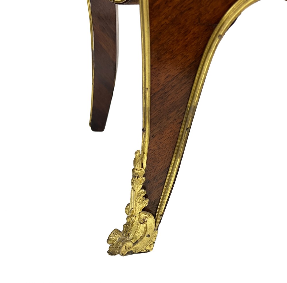 A serpentine French Louis XV style vitrine cabinet featuring gilded ormolu mounts, glazed glass door, and a hand-painted Vernis Martin lower panel depicting romantic figures. View XII