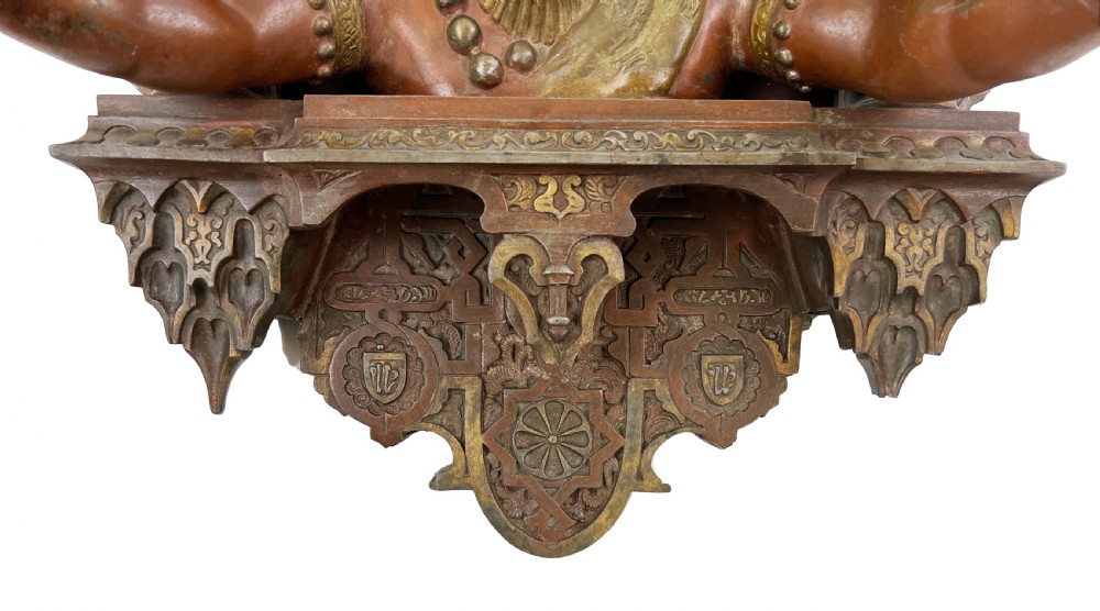 A late nineteenth-century patinated bronze wall light crafted in the Orientalist style, depicting a figure within a decorated Moorish arch. View III