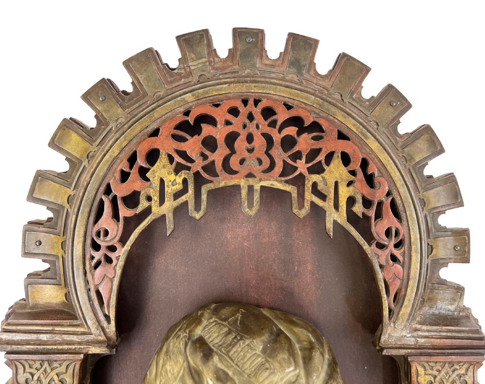 A late nineteenth-century patinated bronze wall light crafted in the Orientalist style, depicting a figure within a decorated Moorish arch. View V
