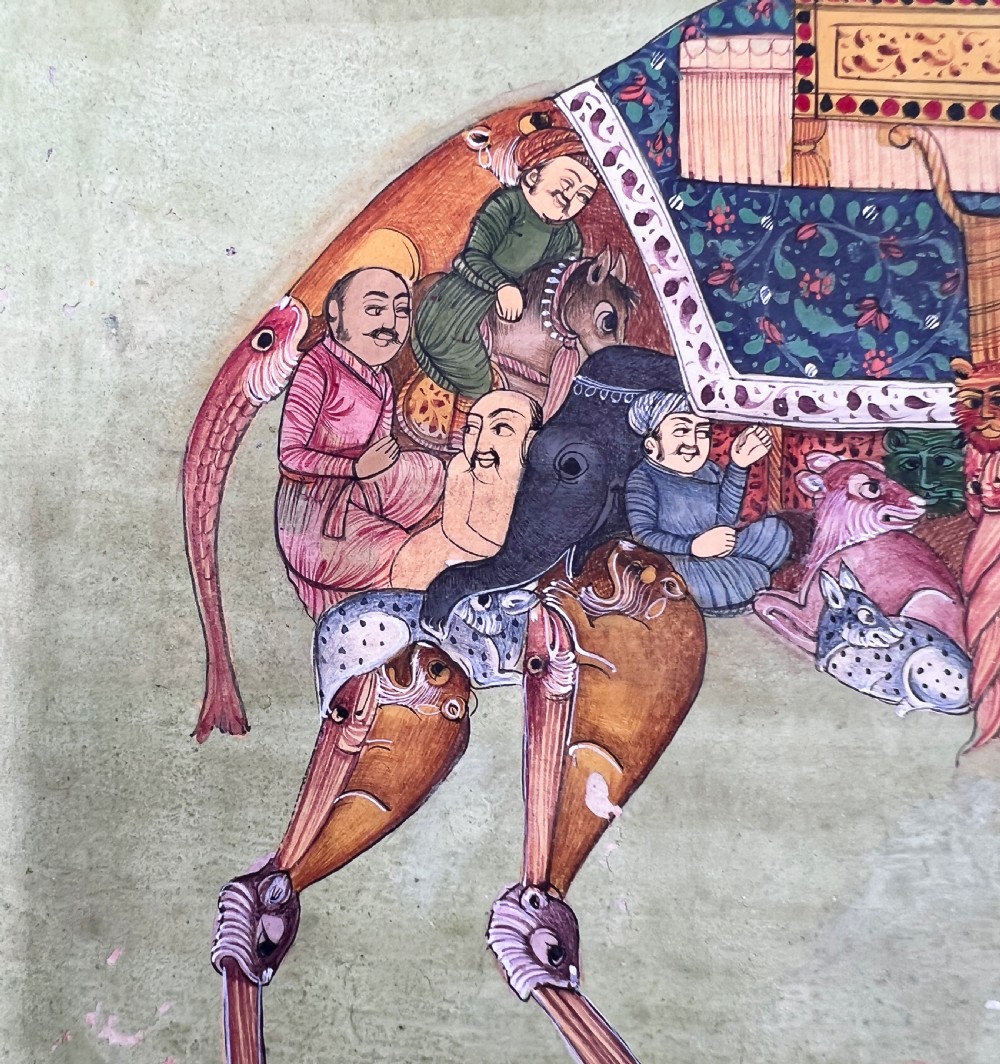 An Indian miniature painting on paper depicting a woman playing a harp within a canopy atop a composite camel, set against a pale green field and framed by a dark floral border. View VIII