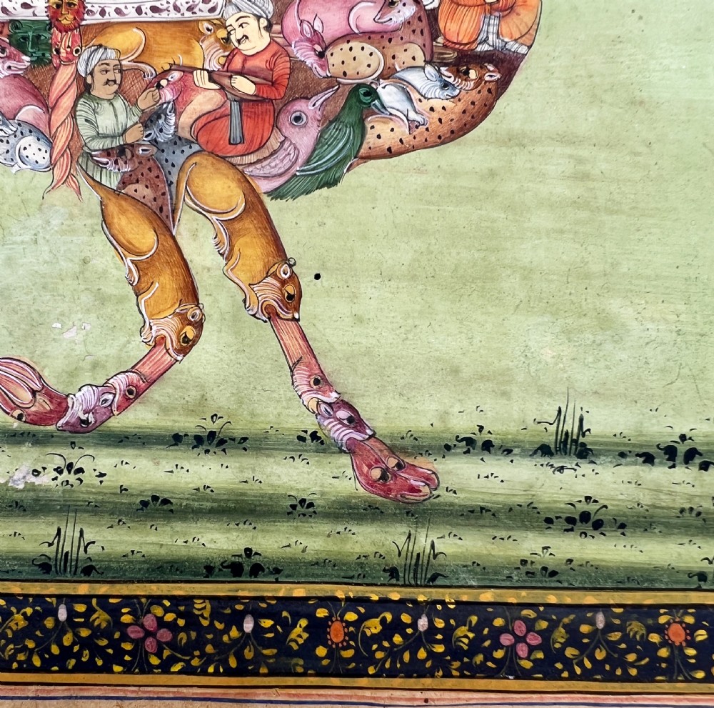 An Indian miniature painting on paper depicting a woman playing a harp within a canopy atop a composite camel, set against a pale green field and framed by a dark floral border. View X
