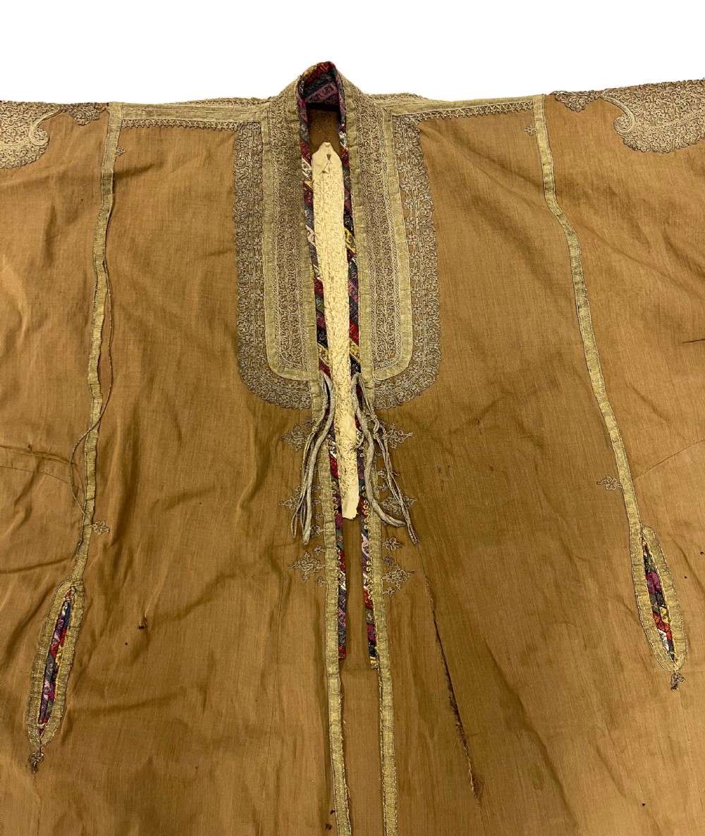 An antique ochre wool Persian Qajar robe featuring metallic thread embroidery around the neckline, shoulders, and cuffs. View IV