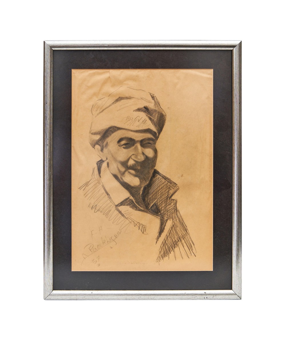 A framed graphite pencil sketch on beige paper depicting a portrait of a man wearing a hat and jacket, signed and dated at the bottom.