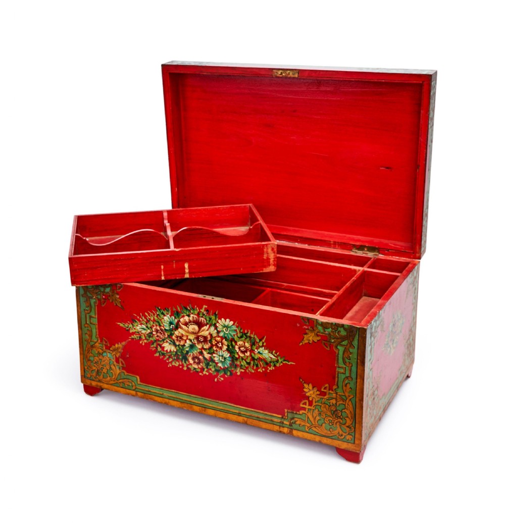 A rectangular 19th-century Persian lacquer cashier box featuring a bright red painted front decorated with a central floral bouquet and green and gold corner foliage. View II