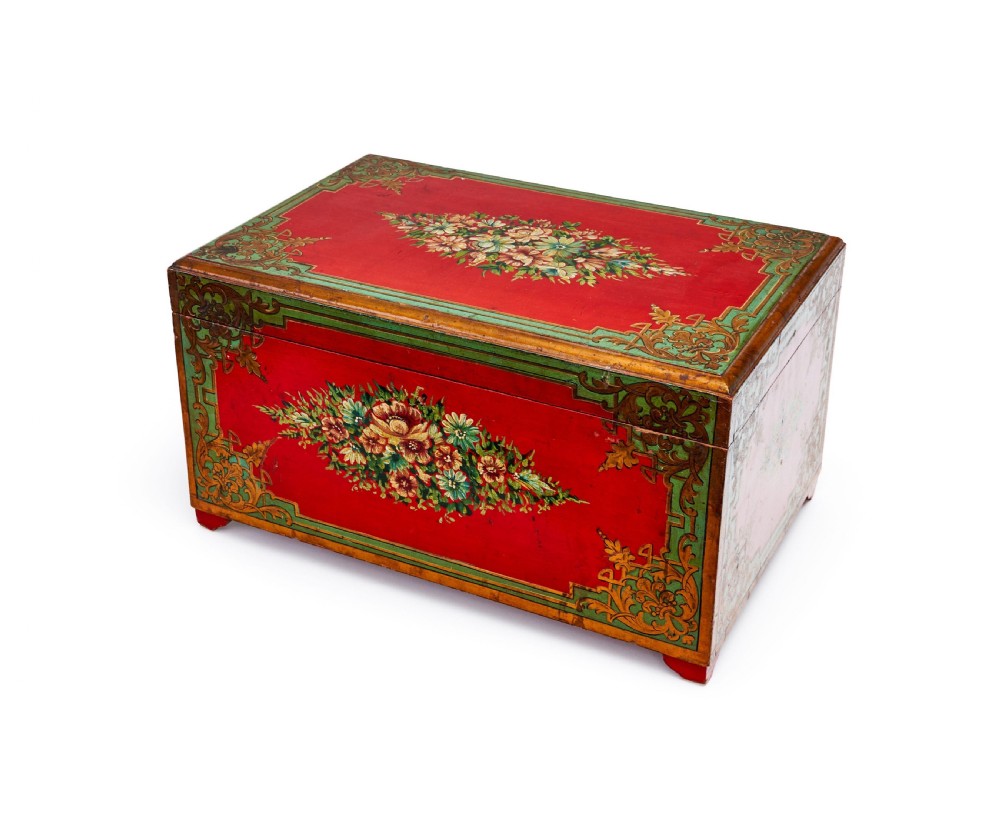 A rectangular 19th-century Persian lacquer cashier box featuring a bright red painted front decorated with a central floral bouquet and green and gold corner foliage. View III
