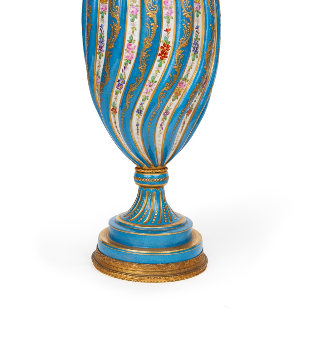A 19th-century Sevres style sky blue and gilt porcelain vase with a cover, featuring spiralled flutes decorated with floral painted garlands. View III