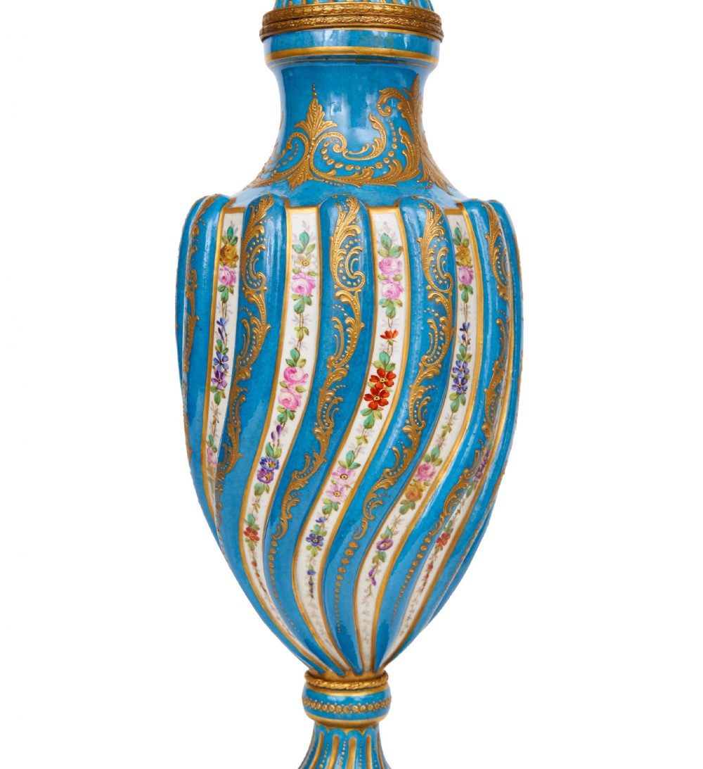A 19th-century Sevres style sky blue and gilt porcelain vase with a cover, featuring spiralled flutes decorated with floral painted garlands. View IV
