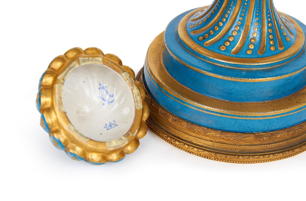 A 19th-century Sevres style sky blue and gilt porcelain vase with a cover, featuring spiralled flutes decorated with floral painted garlands. View V