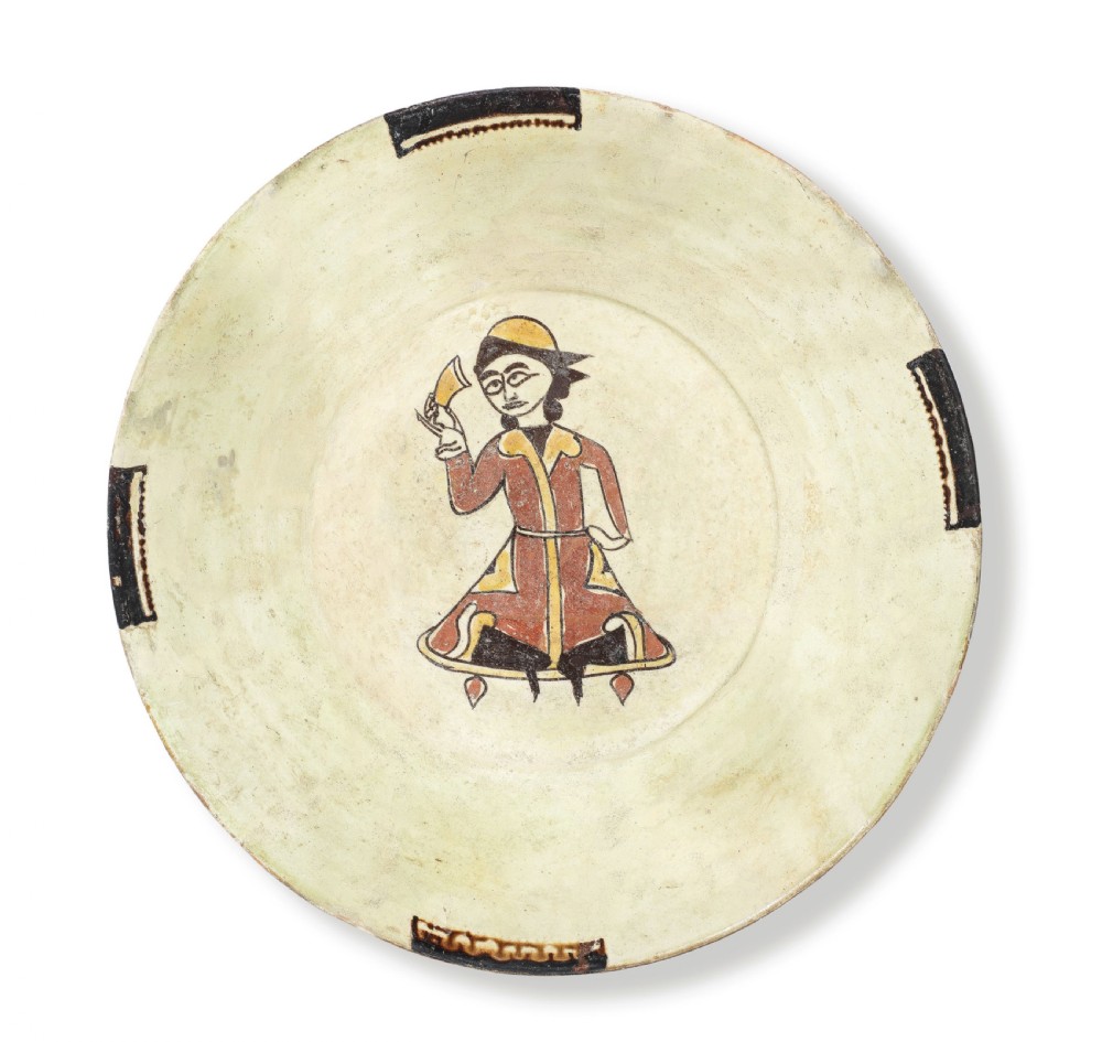 A tenth-century Nishapur slip-painted earthenware bowl featuring a central seated figure holding a vessel against a cream background. View III