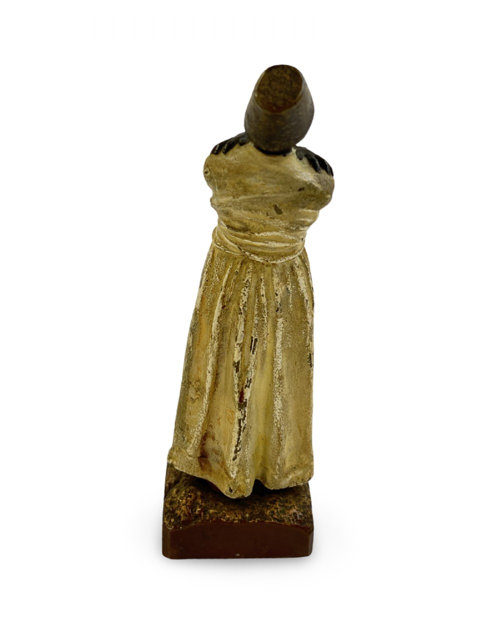 A cold painted bronze statuette depicting a standing whirling dervish with arms crossed, wearing a tall hat and long cream robe. View IV