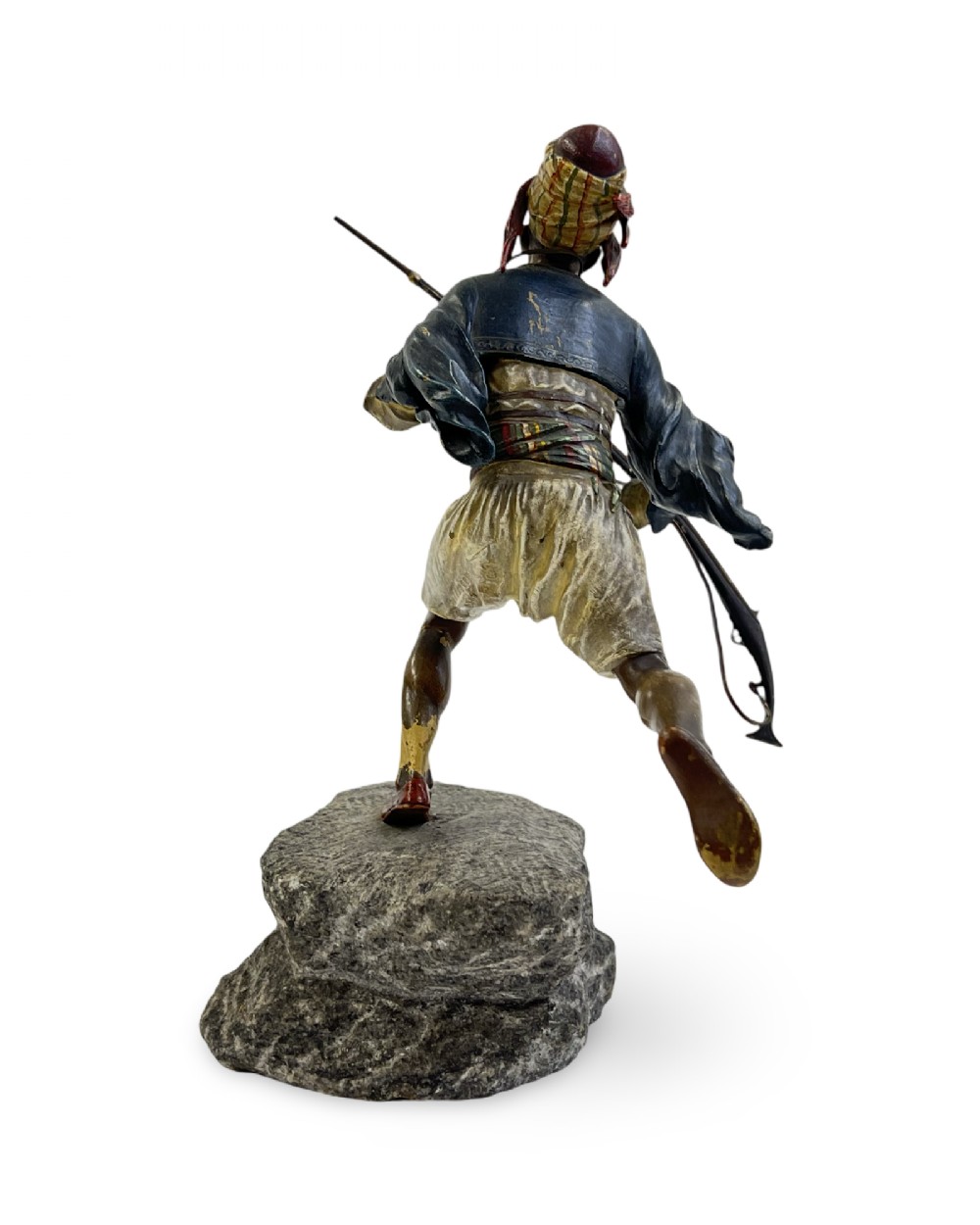 A cold-painted bronze figure depicting a Moorish warrior in motion on a faux rock base, holding a long rifle. View III
