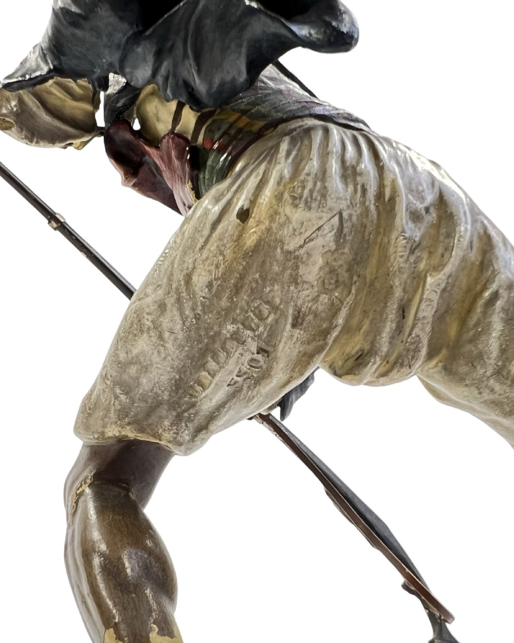 A cold-painted bronze figure depicting a Moorish warrior in motion on a faux rock base, holding a long rifle. View V