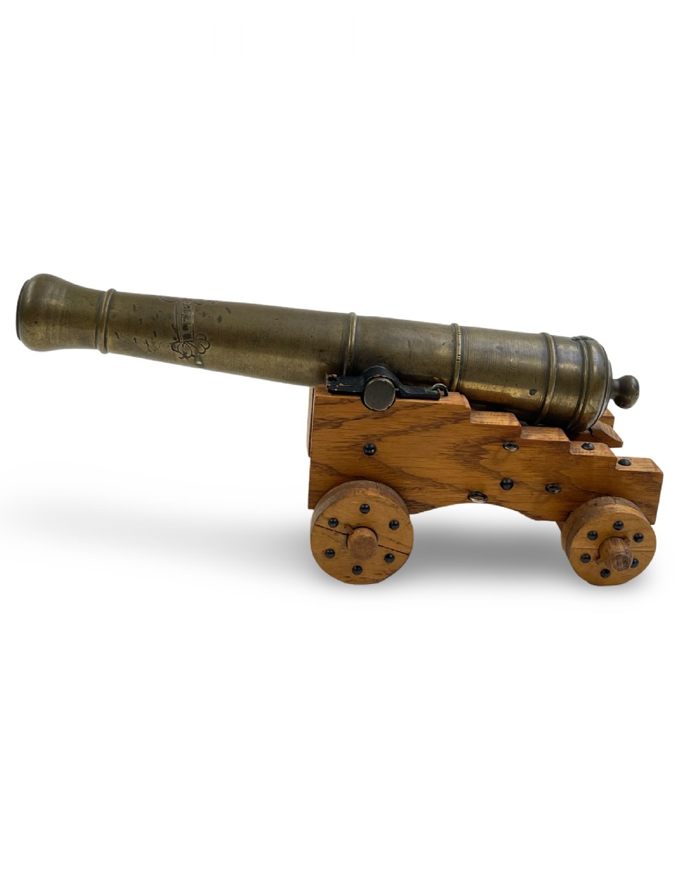A small cast bronze signal cannon barrel with etched inscriptions mounted on a wooden stepped carriage with four wheels. View III