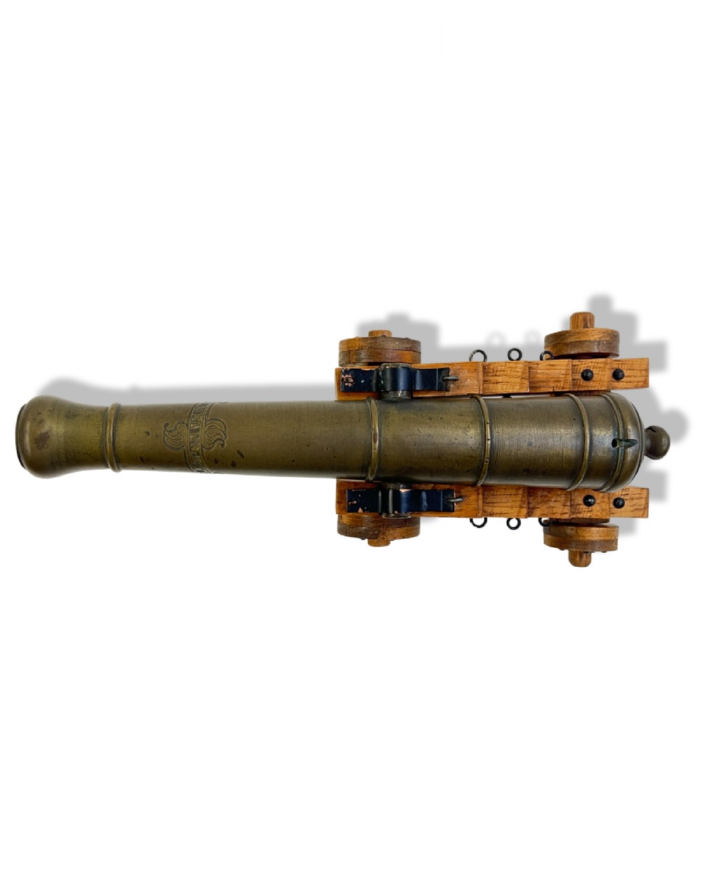 A small cast bronze signal cannon barrel with etched inscriptions mounted on a wooden stepped carriage with four wheels. View V