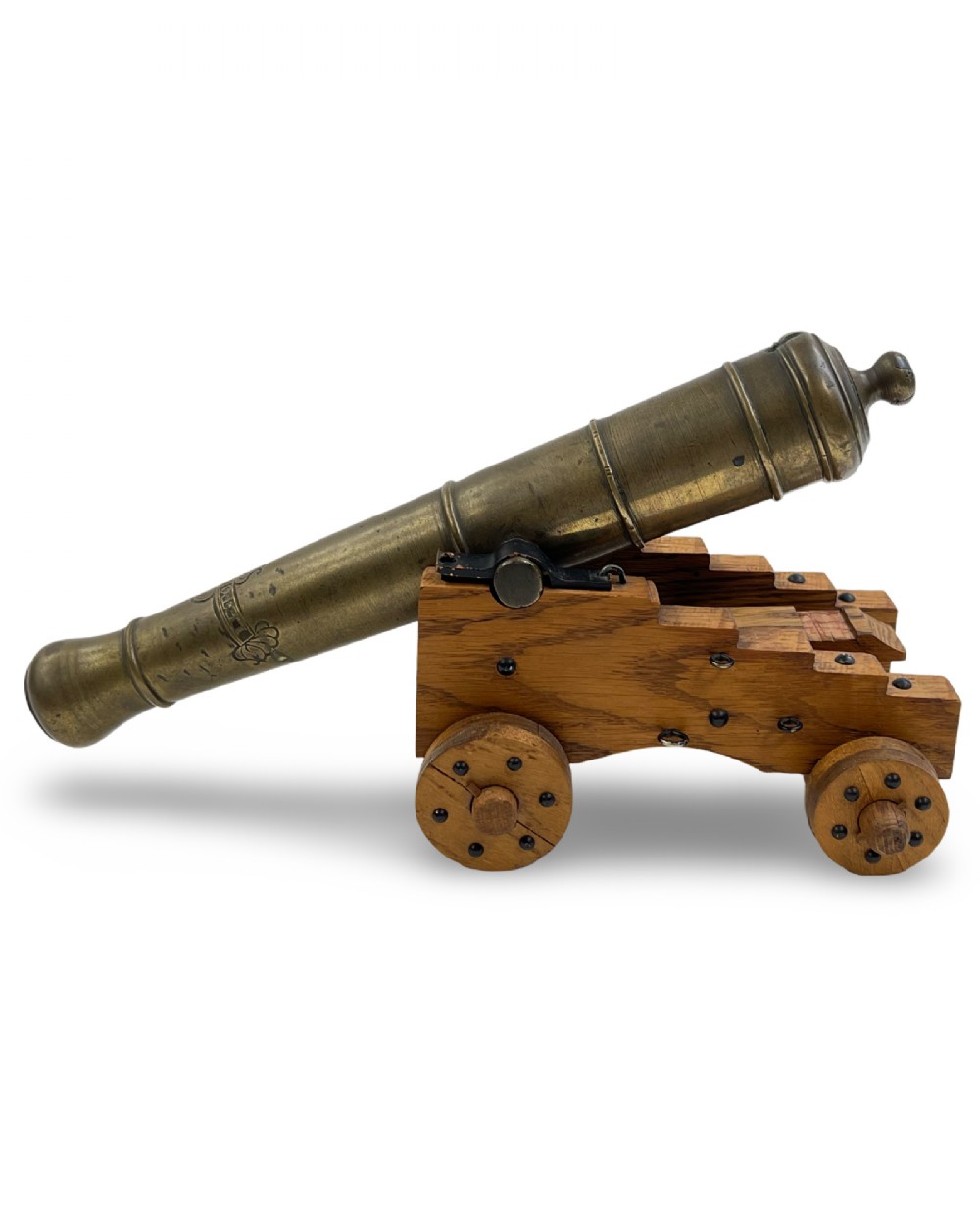 A small cast bronze signal cannon barrel with etched inscriptions mounted on a wooden stepped carriage with four wheels. View VI