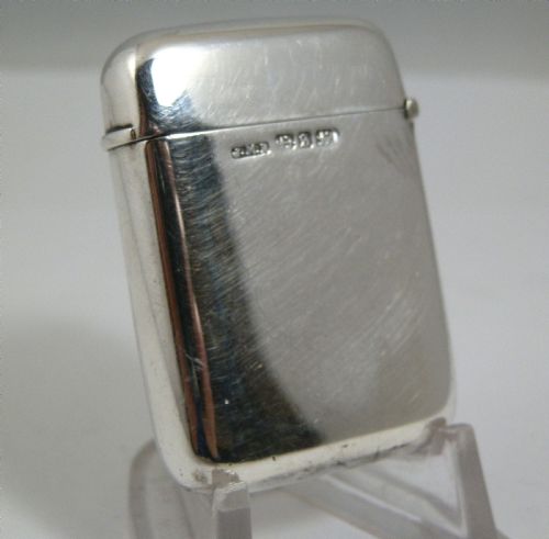 fig 1. A Victorian sterling silver vesta case decorated with an enamelled nautical signal flag design on the front.