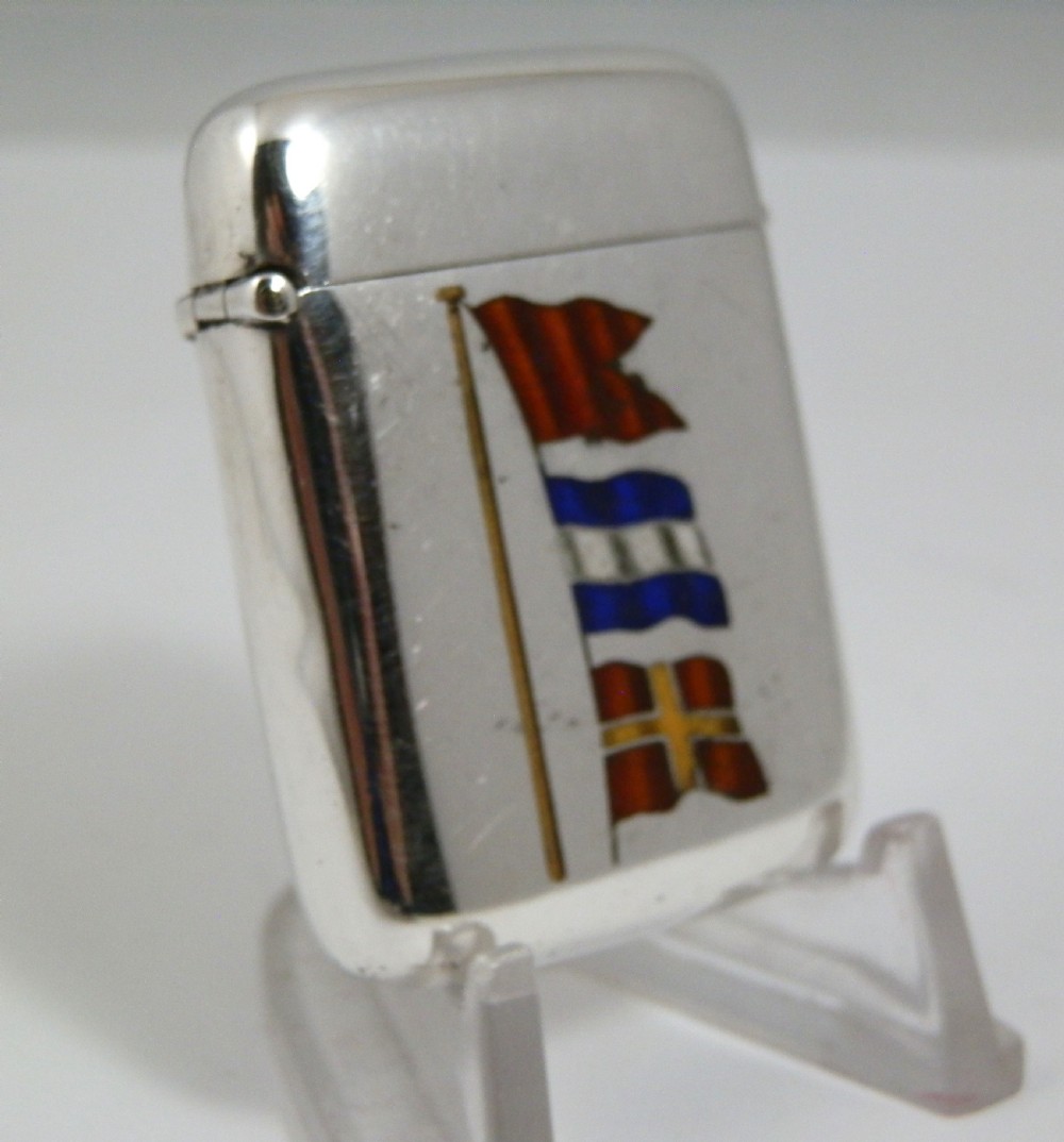 A Victorian sterling silver vesta case decorated with an enamelled nautical signal flag design on the front.