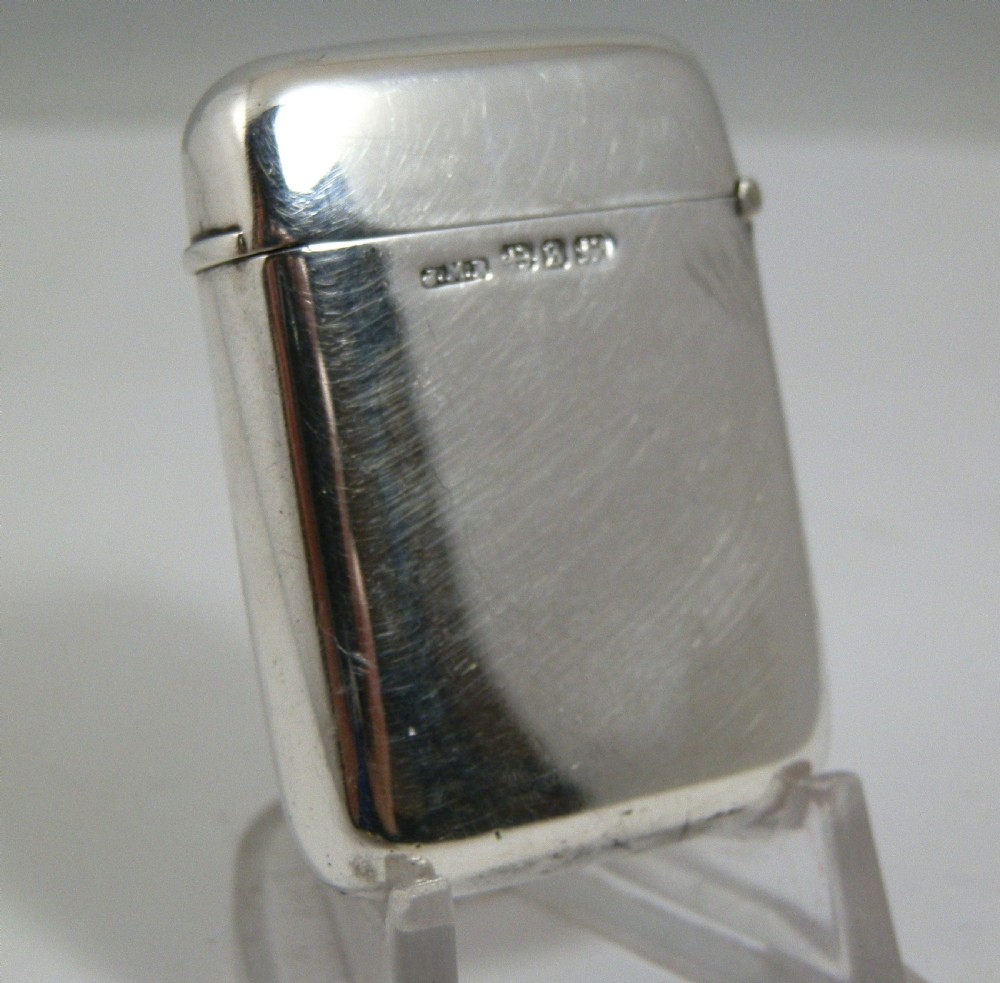 A Victorian sterling silver vesta case decorated with an enamelled nautical signal flag design on the front. View II