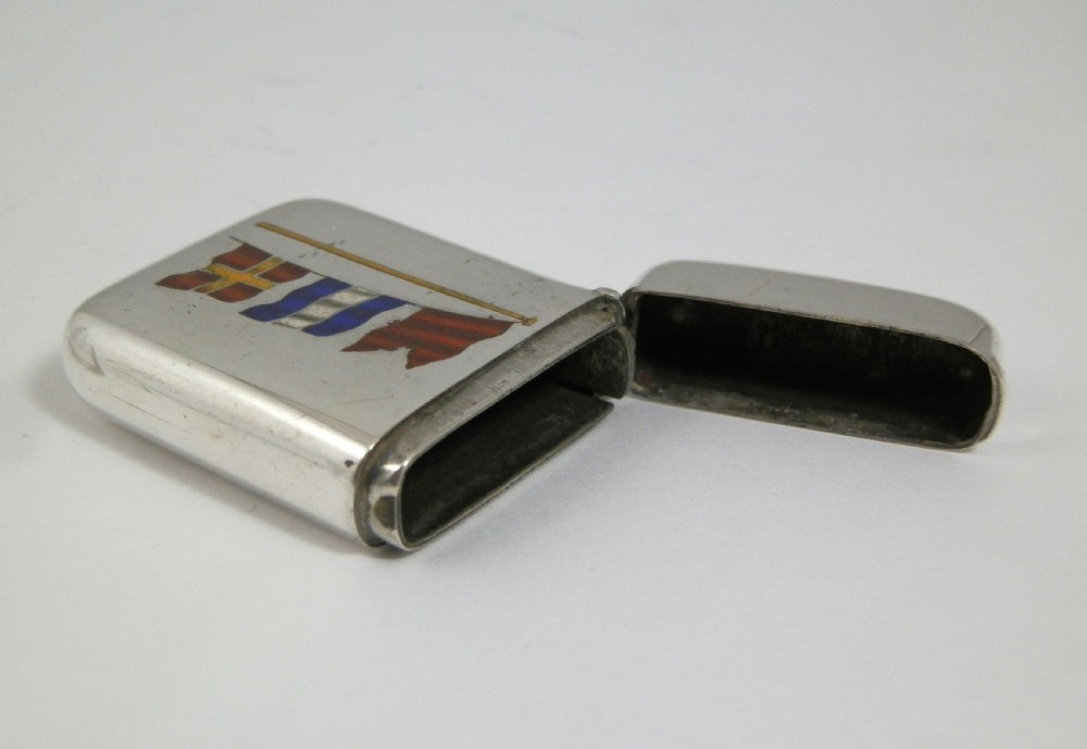 A Victorian sterling silver vesta case decorated with an enamelled nautical signal flag design on the front. View VII