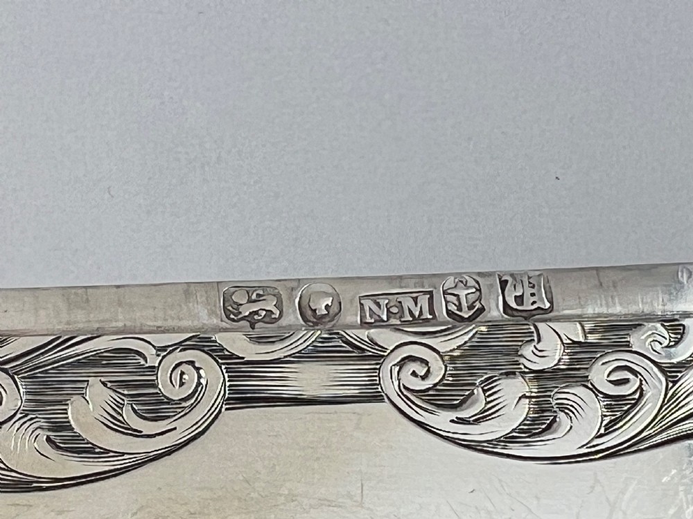 An engraved sterling silver card case featuring a central depiction of St Pauls Cathedral framed by intricate scrollwork. View VI