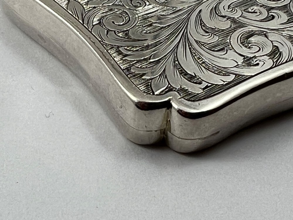 An engraved sterling silver card case featuring a central depiction of St Pauls Cathedral framed by intricate scrollwork. View IX