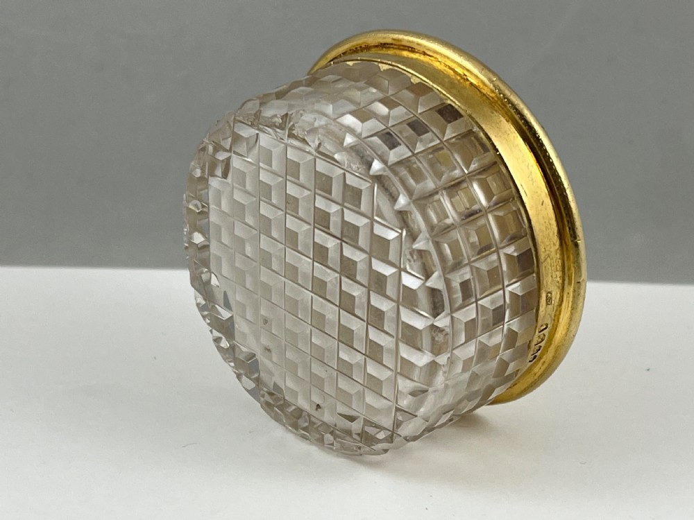 A circular George IV cut glass travelling inkwell with an engine-turned silver gilt lid and latch mechanism. View VII
