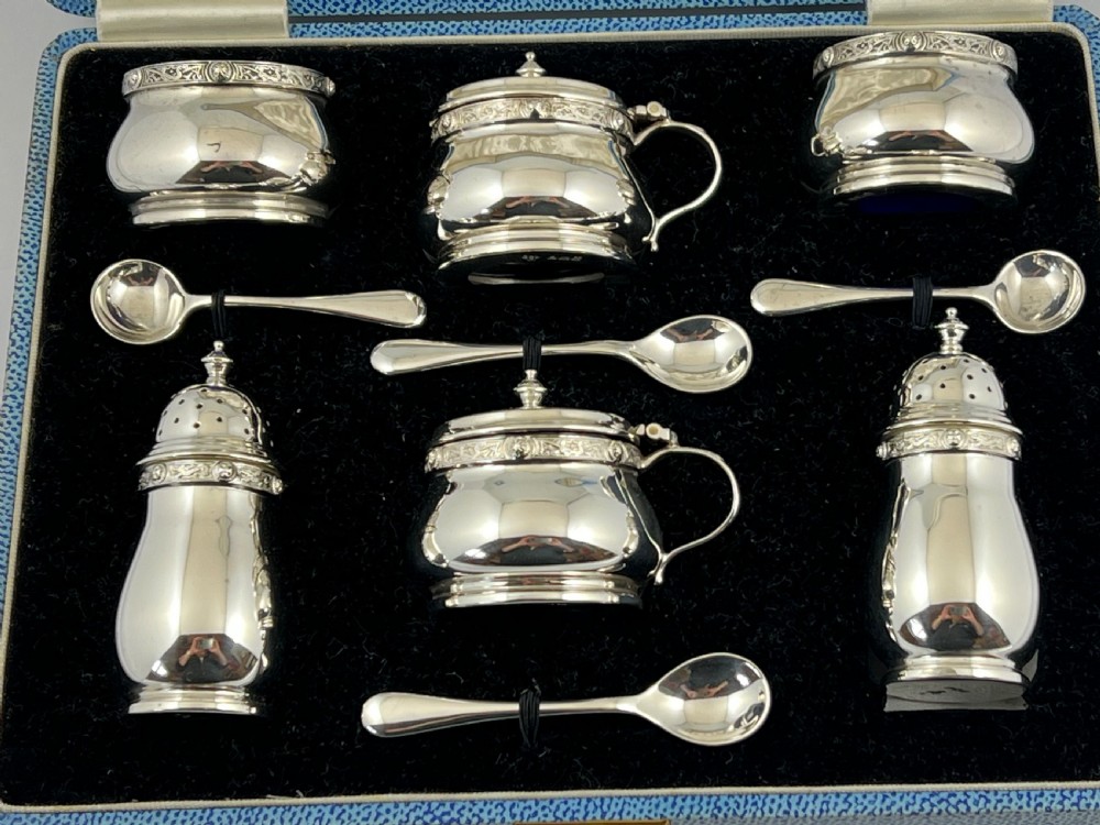 Cased 9 piece antique silver condiment set by Henderson & Sorley. Glasgow 1936