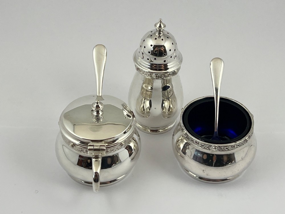 Cased 9 piece antique silver condiment set by Henderson & Sorley. Glasgow 1936 View II