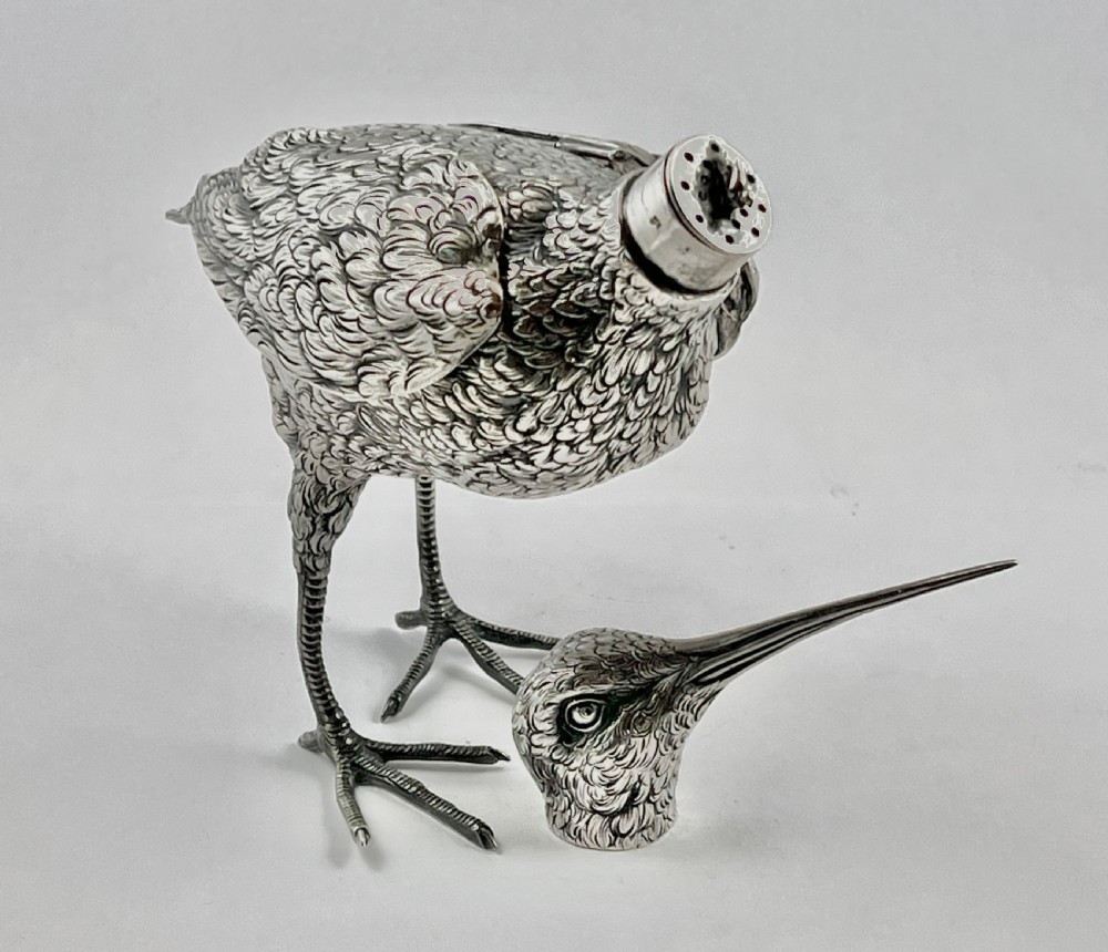 An antique silver woodcock figure depicted standing with realistic chased feather detailing and a long slender beak. View VII
