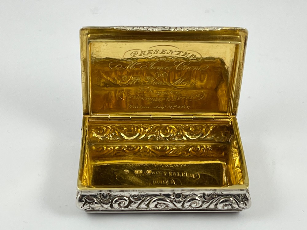 Rectangular sterling silver snuff box featuring a relief-carved hunting scene with a rider on horseback surrounded by hounds in a woodland setting. View VII