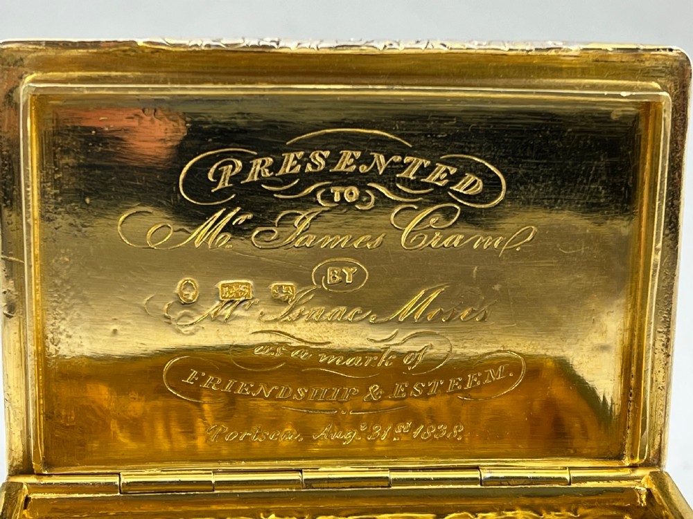 Rectangular sterling silver snuff box featuring a relief-carved hunting scene with a rider on horseback surrounded by hounds in a woodland setting. View VIII
