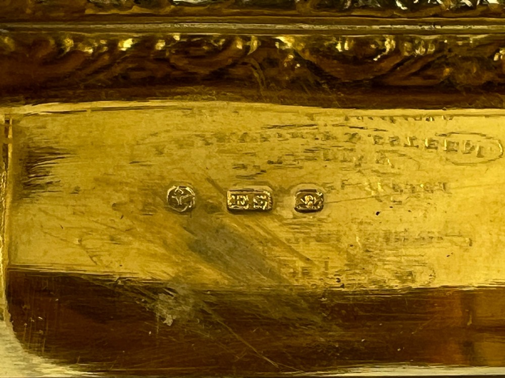 Rectangular sterling silver snuff box featuring a relief-carved hunting scene with a rider on horseback surrounded by hounds in a woodland setting. View X