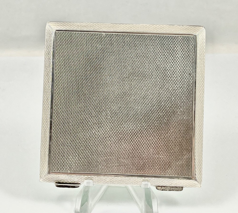 A stunning Elizabeth II green enamel and silver compact, 1953 View II