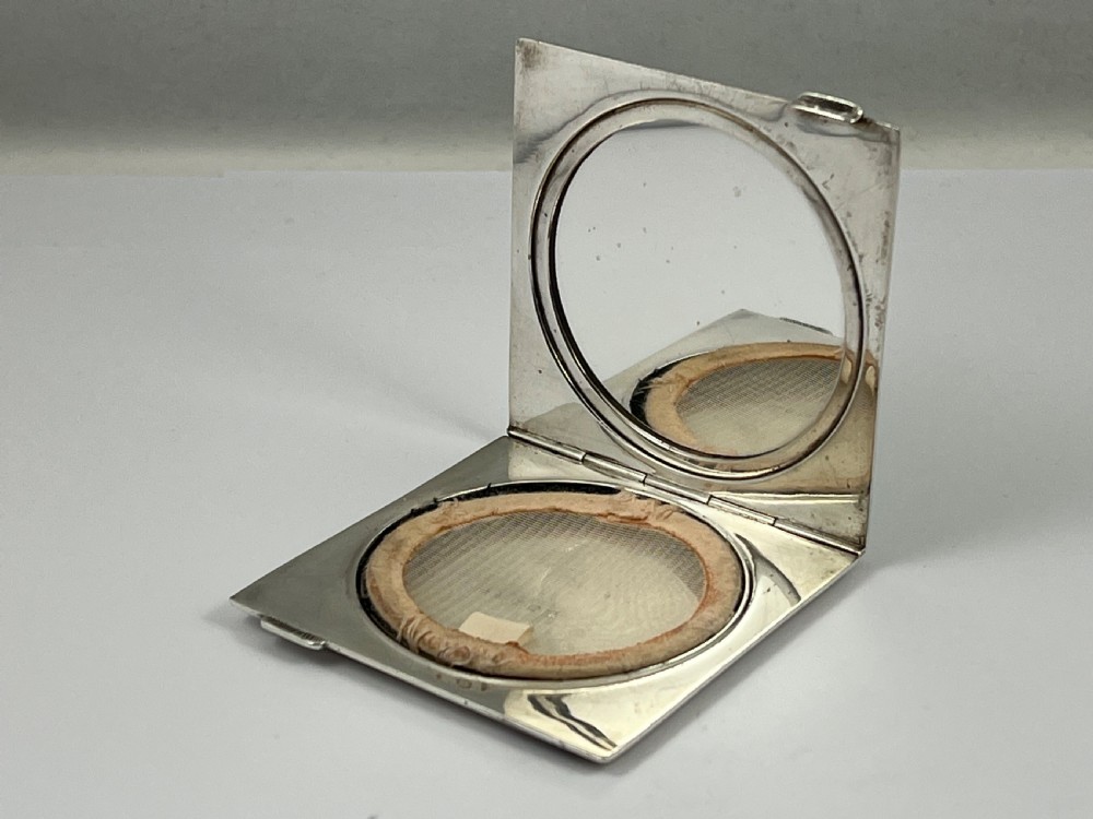 A stunning Elizabeth II green enamel and silver compact, 1953 View III