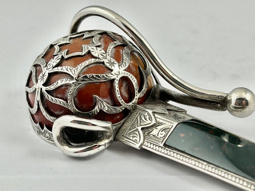 








Edwardian antique silver and agate sword paperknife, 1907 View VIII