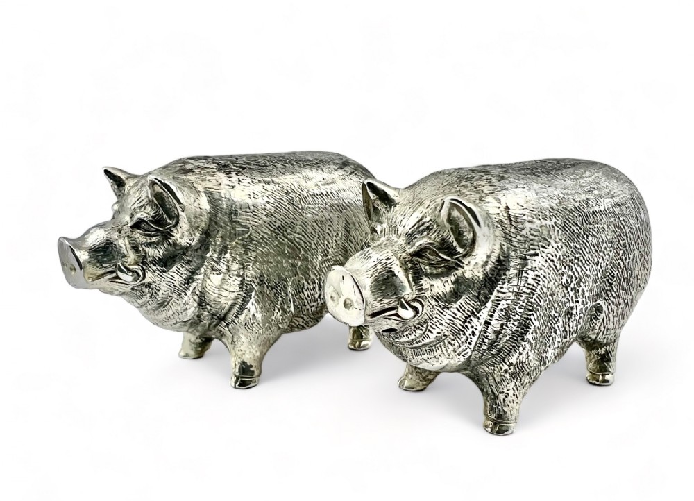 Pair of silver condiments styled as pigs, c 1960