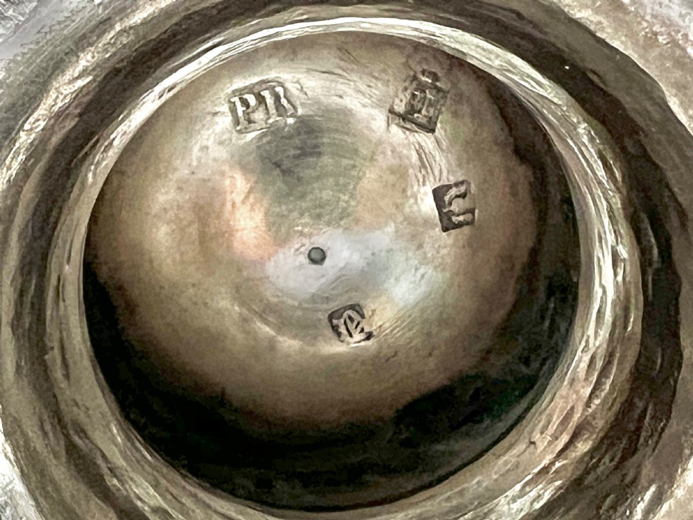 An 18th-century George III Scottish sterling silver two-handled cup featuring a stepped pedestal base, polished finish, and hand-engraved floral swags. View II
