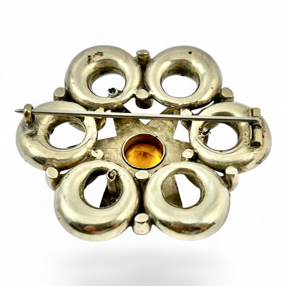 Victorian silver Scottish brooch with inlaid multicoloured agates surrounding a central star motif set with a faceted yellow citrine. View II