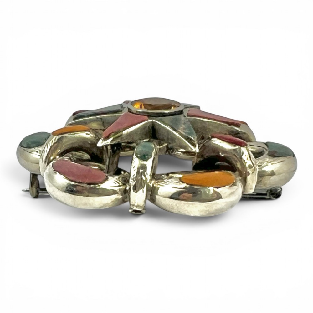 Victorian silver Scottish brooch with inlaid multicoloured agates surrounding a central star motif set with a faceted yellow citrine. View III